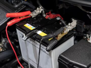 jumper cables attached to a car battery